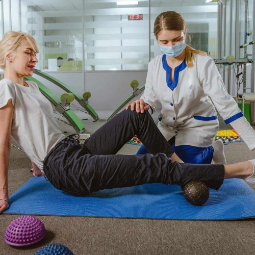 female-doctor-rehabilitologist-showing-female-pati-2023-11-27-04-52-09-M3P5B8K.jpg